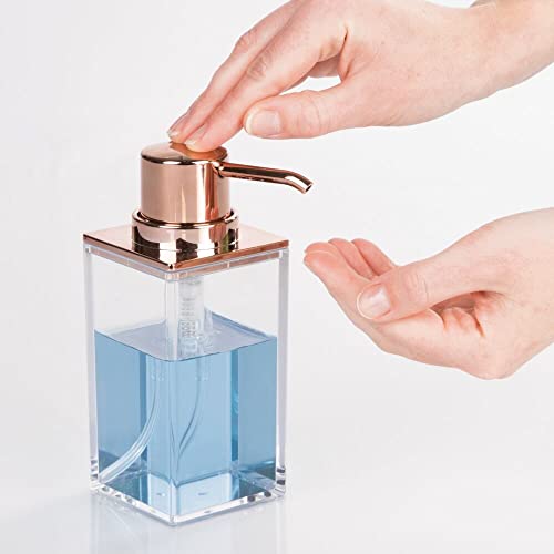 mDesign Plastic Bathroom Vanity Countertop Accessory Set - Includes,Soap Dispenser, Toothbrush Holder, Lidded Canister, and Tumbler Rinsing Cup; Lumiere Collection - Set of 4 - Clear/Rose Gold