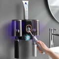 Toothbrush Holders for Bathrooms, Wekity Automatic Toothpaste Dispenser Space Saving Toothbrush and Toothpaste Holder，Toothbrush Holder Wall Mounted with 2 Cups for Bathroom (Black)… - color: Black